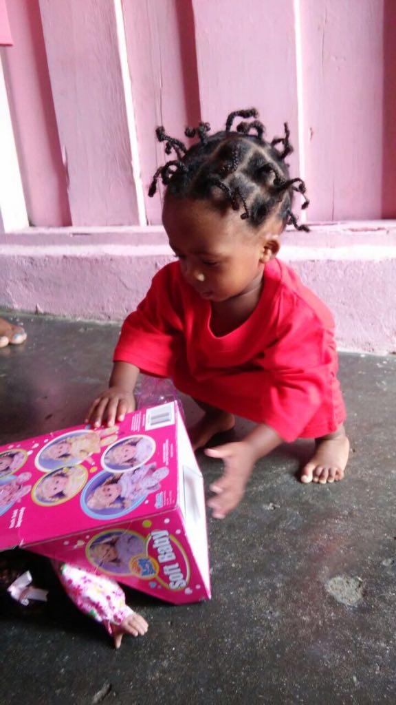 One young child exploring an educational toy during a Foundation-supported activity